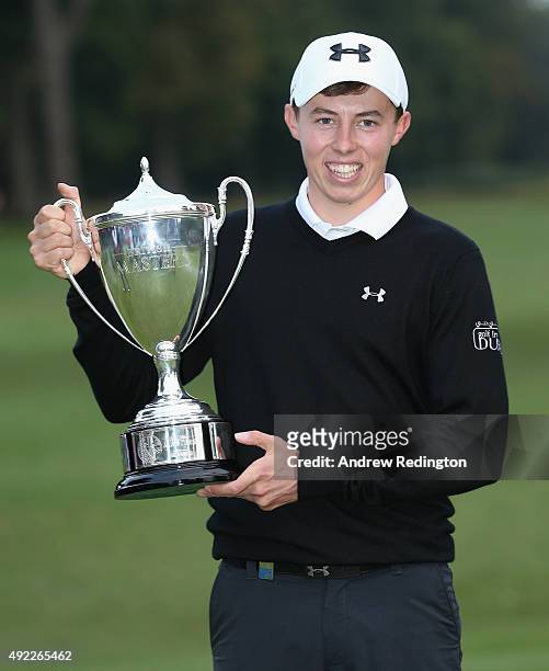 Matthew Fitzpatrick of England poses with the trophy after winning the British Masters supported by Sky Sports at Woburn Golf Club on October 11,...