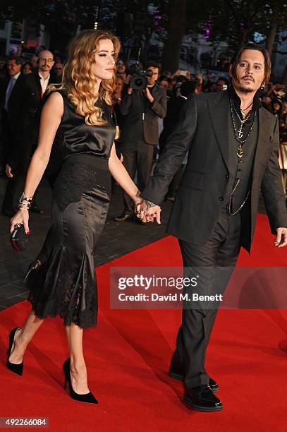 Amber Heard and Johnny Depp attend the Virgin Atlantic gala screening of "Black Mass" during the BFI London Film Festival at Odeon Leicester Square...