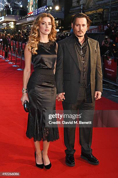 Amber Heard and Johnny Depp attend the Virgin Atlantic gala screening of "Black Mass" during the BFI London Film Festival at Odeon Leicester Square...