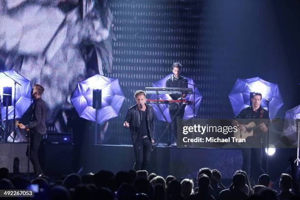 OneRepublic perform onstage during the 2014 Billboard Music Awards held at MGM Grand Garden Arena on May 18, 2014 in Las Vegas, Nevada.