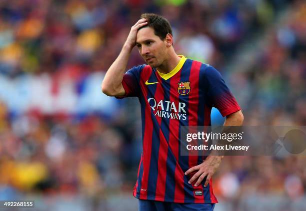Lionel Messi of FC Barcelona looks dejected during the La Liga match between FC Barcelona and Club Atletico de Madrid at Camp Nou on May 17, 2014 in...