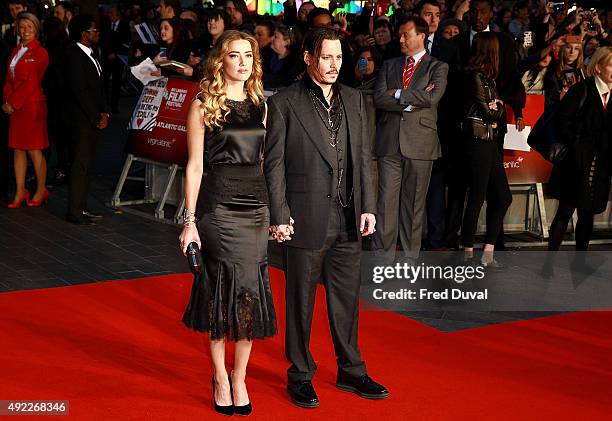 Amber Heard and Johnny Depp attend the "Black Mass" Virgin Atlantic Gala screening during the BFI London Film Festival, at Odeon Leicester Square on...