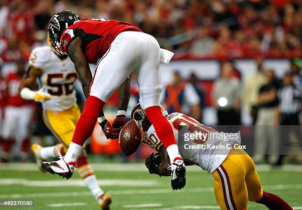 Julio Jones of the Atlanta Falcons fails to pull in this reception against Kyshoen Jarrett of the Washington Redskins at Georgia Dome on October 11,...