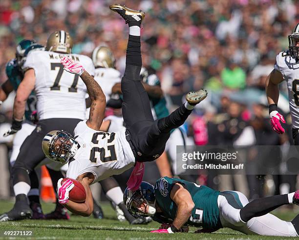 Chris Maragos of the Philadelphia Eagles upends Marcus Murphy of the New Orleans Saints on October 11, 2015 at Lincoln Financial field in...