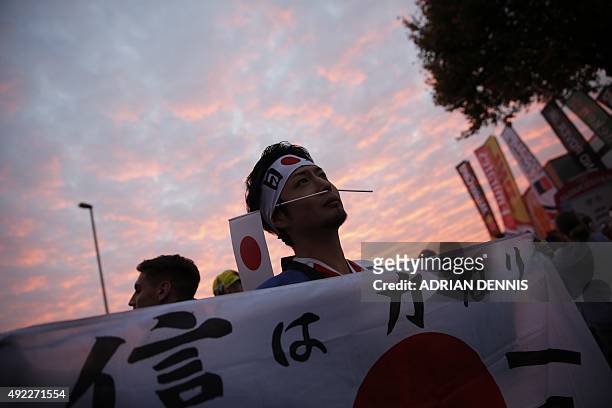 Japan fan poses outside the stadium ahead of the Pool B match of the 2015 Rugby World Cup between USA and Japan at Kingsholm stadium in Gloucester,...