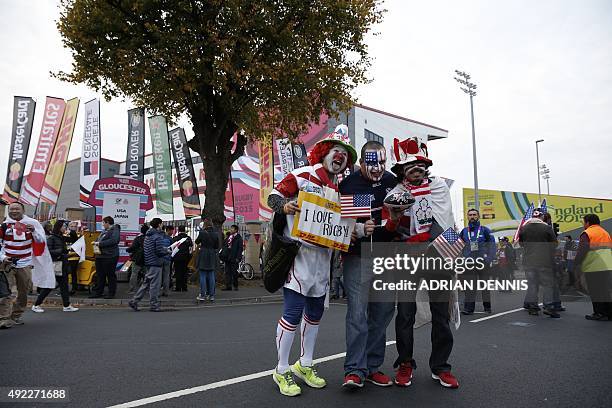 Rugby fans following Japan and the USA pose outside the stadium ahead of the Pool B match of the 2015 Rugby World Cup between USA and Japan at...