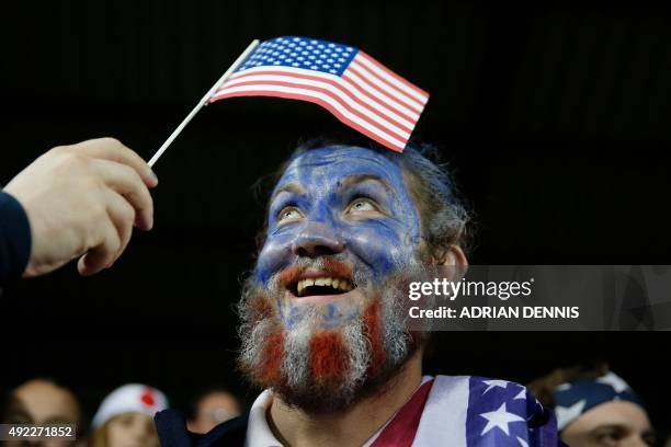 Rugby fan with his face painted looks at a USA flag in the crowd ahead of the Pool B match of the 2015 Rugby World Cup between USA and Japan at...