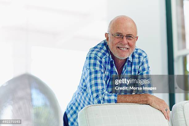 happy senior man at home - checked shirt stock pictures, royalty-free photos & images