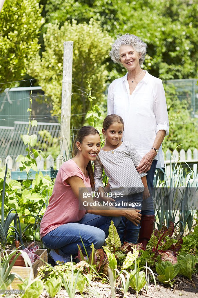 Family gardening together in yard