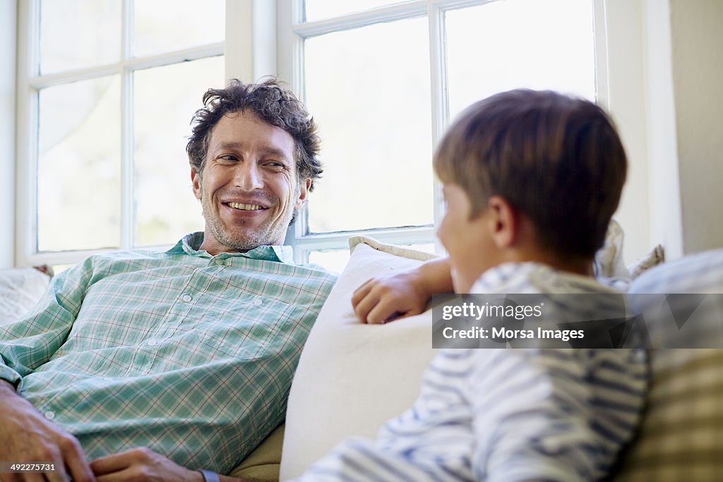 Father spending leisure time with son in porch