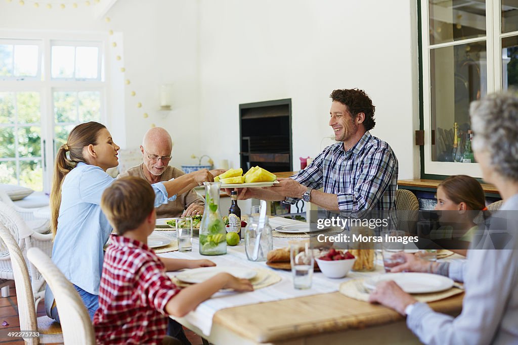 Family having meal at dining table