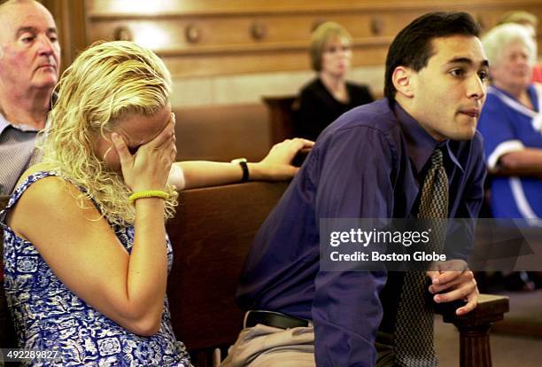 Dr. Dirk Greineder 's daughter, Britt Greineder, breaks down during the testimony of her aunt, Ilse Stark, with her brother, Colin Greineder, right....