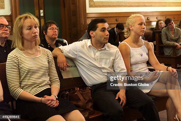 Dr. Dirk Greineder's children, left to right, Kirsten, Colin and Britt, watch today's proceedings at Norfolk Superior Court in Dedham, Mass on June...