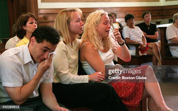 Children of Dr. Dirk Greineder, left to right, Colin, Kirsten and Britt, listen to testimony by their father during his trial for the murder of their...