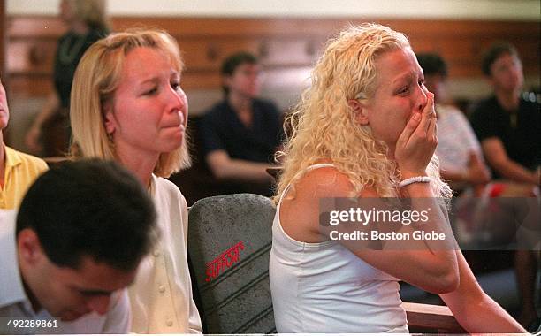 Children of Dr. Dirk Greineder, left to right, Colin, Kirsten, and Britt, listen to testimony by their father during his trial for the murder of...