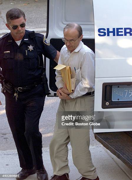 Dr. Dirk K. Greineder makes his way into Norfolk Superior Court in Dedham, Mass. On the morning of June 28, 2001. Greineder, an allergist at Brigham...