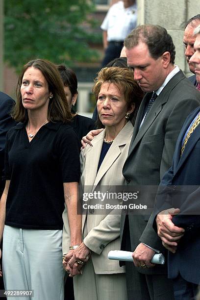 Left to right, Belinda Markel, daughter of Ilse Stark, center, and Asst. District Attorney Rick Grundy stand together during a press conference on...