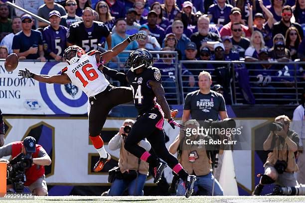 Wide receiver Andrew Hawkins of the Cleveland Browns misses a catch while defensive back Kyle Arrington of the Baltimore Ravens defends in the second...