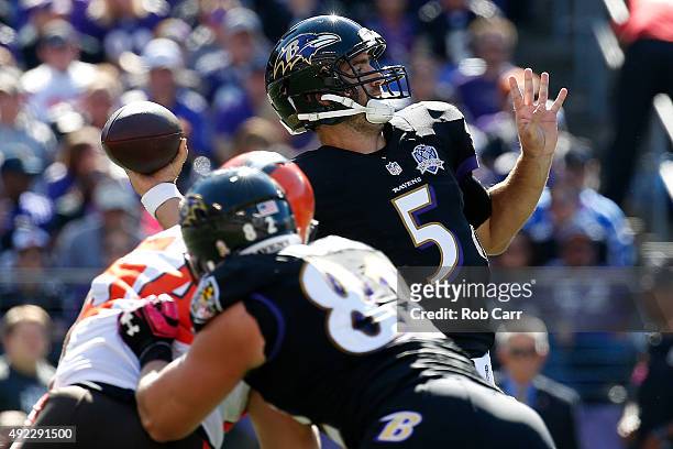 Quarterback Joe Flacco of the Baltimore Ravens drops back to pass while Baltimore Ravens tight end Nick Boyle of the Baltimore Ravens blocks...
