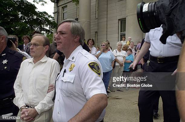 Dr. Dirk Greineder is escorted from Norfolk Superior Court in handcuffs on June 29 after being convicted of first-degree murder in the death of his...