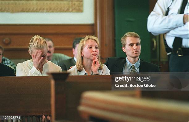 Children of Dr. Dirk Greineder, Britt, Kirsten and Colin, sit in the courtroom as their father, accused of murdering his wife and their mother, is...