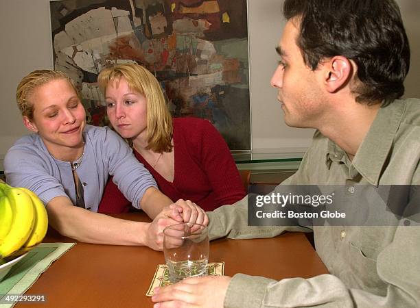 Children of Dr. Dirk Greineder, left to right, Britt Greineder Kirsten Greineder and Colin Greineder sit at the dining room table and discuss why...