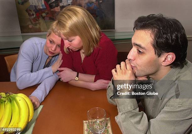 Children of Dr. Dirk Greineder, left to right, Britt Greineder Kirsten Greineder and Colin Greineder sit at the dining room table and discuss why...