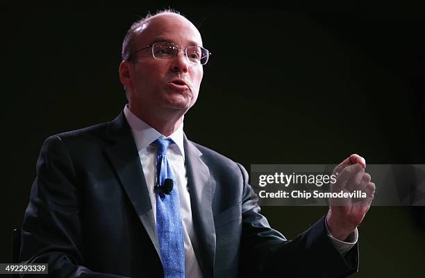 Politico's Chief White House correspondent Mike Allen introduces former U.S. Treasury Secretary Timothy Geithner during the Politico Playbook Lunch...