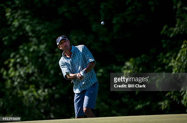 Rep. Duncan Hunter, R-Calif., chips to the green during the First Tee Congressional Challenge golf tournament at the Columbia Country Club in Chevy...