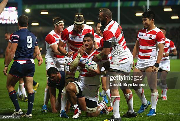 Amanaki Mafi of Japan celebrates scoring their third try during the 2015 Rugby World Cup Pool B match between USA and Japan at Kingsholm Stadium on...