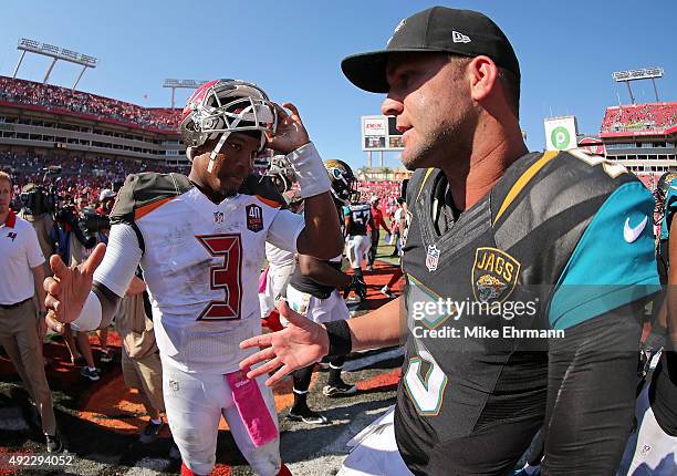 Jameis Winston of the Tampa Bay Buccaneers and Blake Bortles of the Jacksonville Jaguars shake hands following a game at Raymond James Stadium on...
