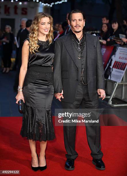 Amber Heard and Johnny Depp attend a screening of "Black Mass" during the BFI London Film Festival at Odeon Leicester Square on October 11, 2015 in...