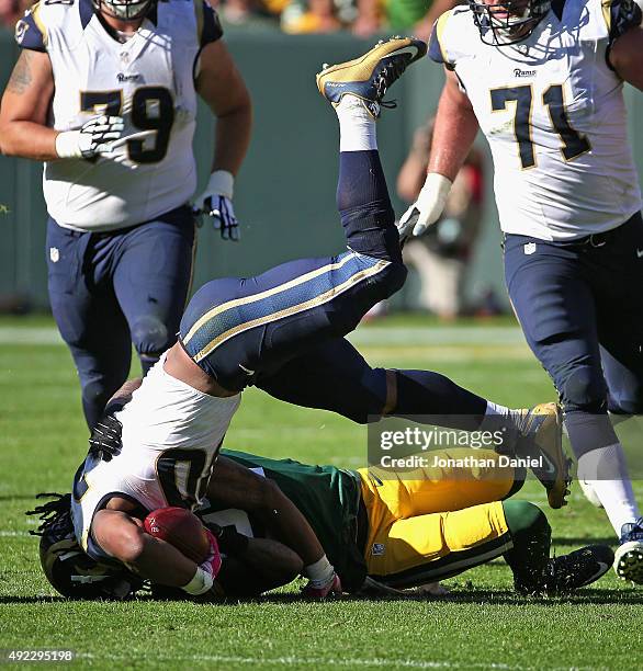 Sam Shields of the Green Bay Packers brings down Todd Gurley of the St. Louis Rams at Lambeau Field on October 11, 2015 in Green Bay, Wisconsin. The...
