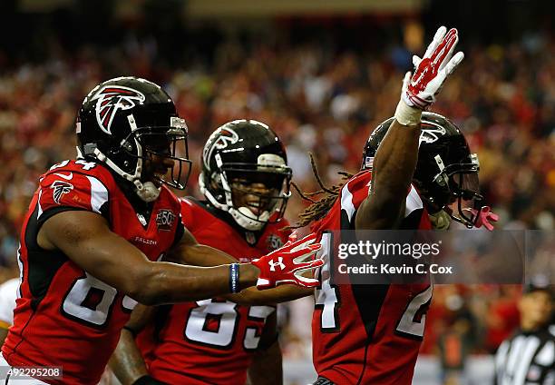 Devonta Freeman of the Atlanta Falcons reacts after scoring a touchdown in the final minutes of regulation against the Washington Redskins at Georgia...