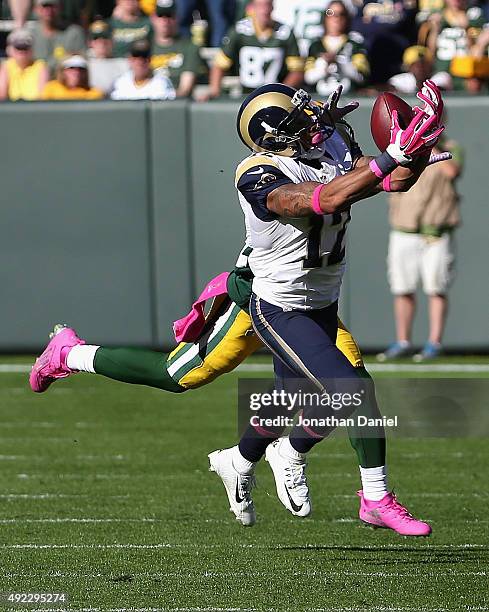 Stedman Bailey of the St. Louis Rams catches a long pass in the closing minutes past Quinten Rollins of the Green Bay Packers at Lambeau Field on...