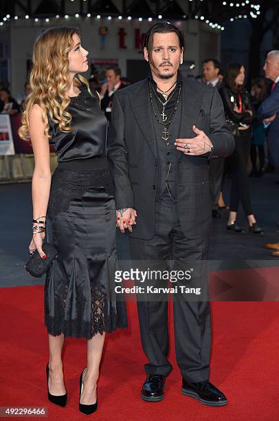 Amber Heard and Johnny Depp attend a screening of "Black Mass" during the BFI London Film Festival at Odeon Leicester Square on October 11, 2015 in...
