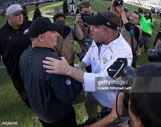 Head coach Chip Kelly of the Philadelphia Eagles shakes hands with head coach Sean Payton of the New Orleans Saints after the game on October 11,...