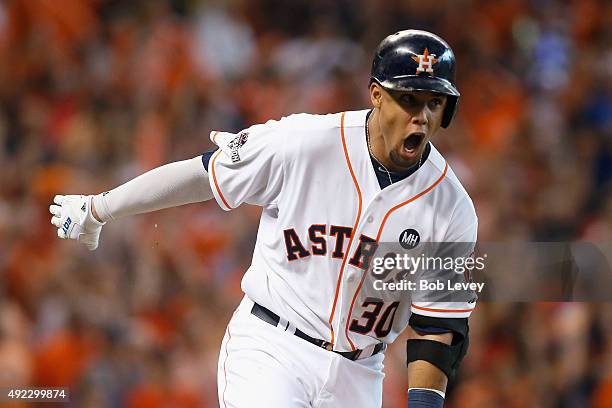 Carlos Gomez of the Houston Astros reacts after hitting an RBI single in the sixth inning against the Kansas City Royals in game three of the...