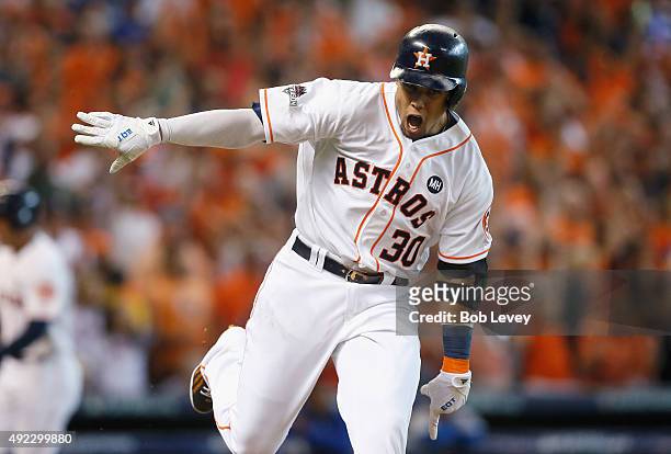 Carlos Gomez of the Houston Astros reacts after hitting an RBI single in the sixth inning against the Kansas City Royals in game three of the...