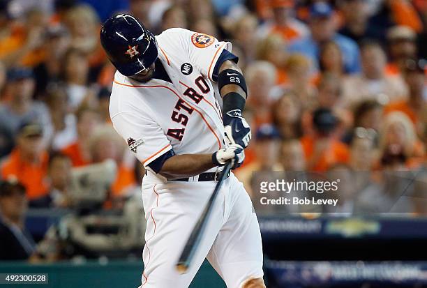 Chris Carter of the Houston Astros hits a solo home run in the seventh inning against the Kansas City Royals in game three of the American League...