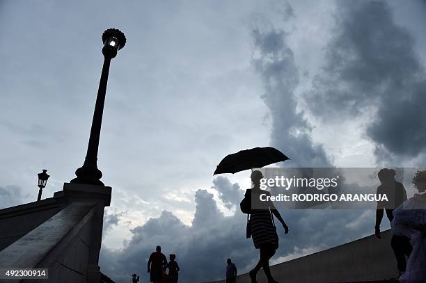 Tourists are seen in Plaza Francia in Panama City, on October 11, 2015. AFP PHOTO / Rodrigo ARANGUA