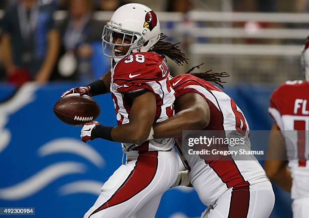 Andre Ellington of the Arizona Cardinals celebrates his fourth quarter touchdown run with Jonathan Cooper while playing the Detroit Lions at Ford...