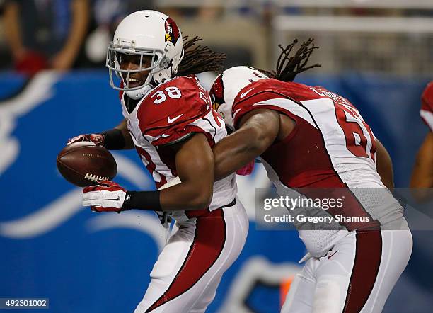 Andre Ellington of the Arizona Cardinals celebrates his fourth quarter touchdown run with Jonathan Cooper while playing the Detroit Lions at Ford...