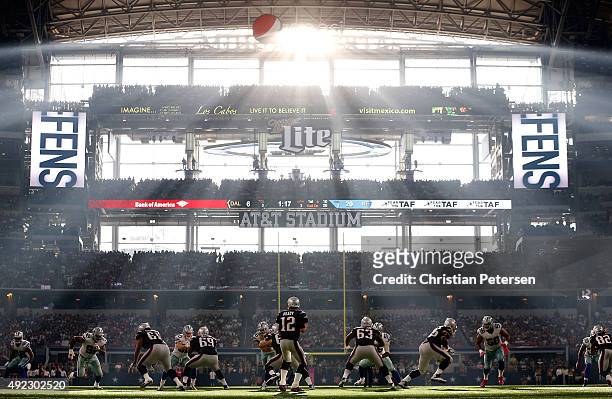 Quarterback Tom Brady of the New England Patriots drops back to pass during the second half of the NFL game against the Dallas Cowboys at AT&T...