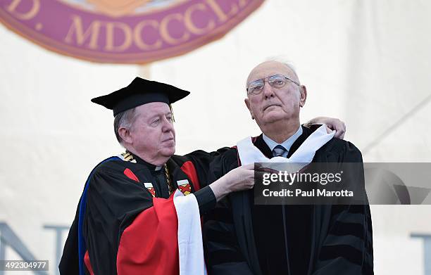 Former Boston Celtics player and basketball Hall of Famer Bob Cousy received an honory degree from B.C. President William Leahy at Boston College's...