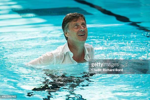 Chairman and CEO of Accor Sebastien Bazin swims in the winter pool at the Piscine Molitor during its inauguration on May 19, 2014 in Paris, France....