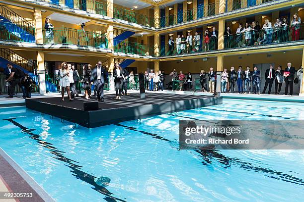 Chairman and CEO of Accor Sebastien Bazin swims in the winter pool at the Piscine Molitor during its inauguration on May 19, 2014 in Paris, France....