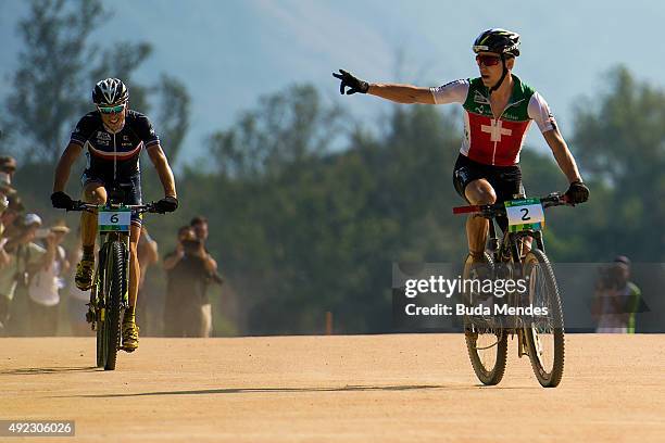 Nino Schurter of Switzerland celebrates his win ahead Maxime Marotte of France during the International Mountain Bike Challenge at the Deodoro Sports...