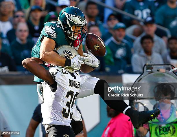 Brandon Browner of the New Orleans Saints breaks up a pass to Riley Cooper of the Philadelphia Eagles in the third quarter during a football game at...