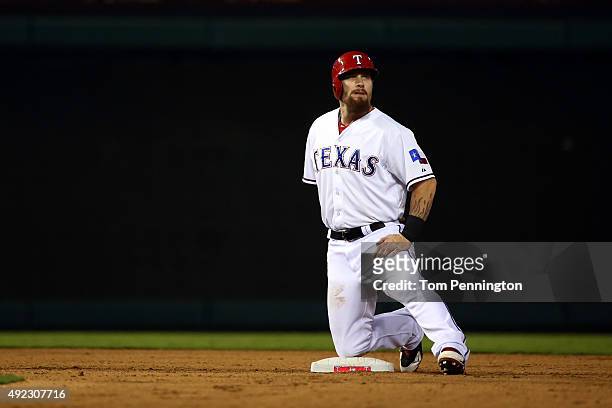 Josh Hamilton of the Texas Rangers stretches after hitting a double in the seventh inning against the Toronto Blue Jays during game three of the...